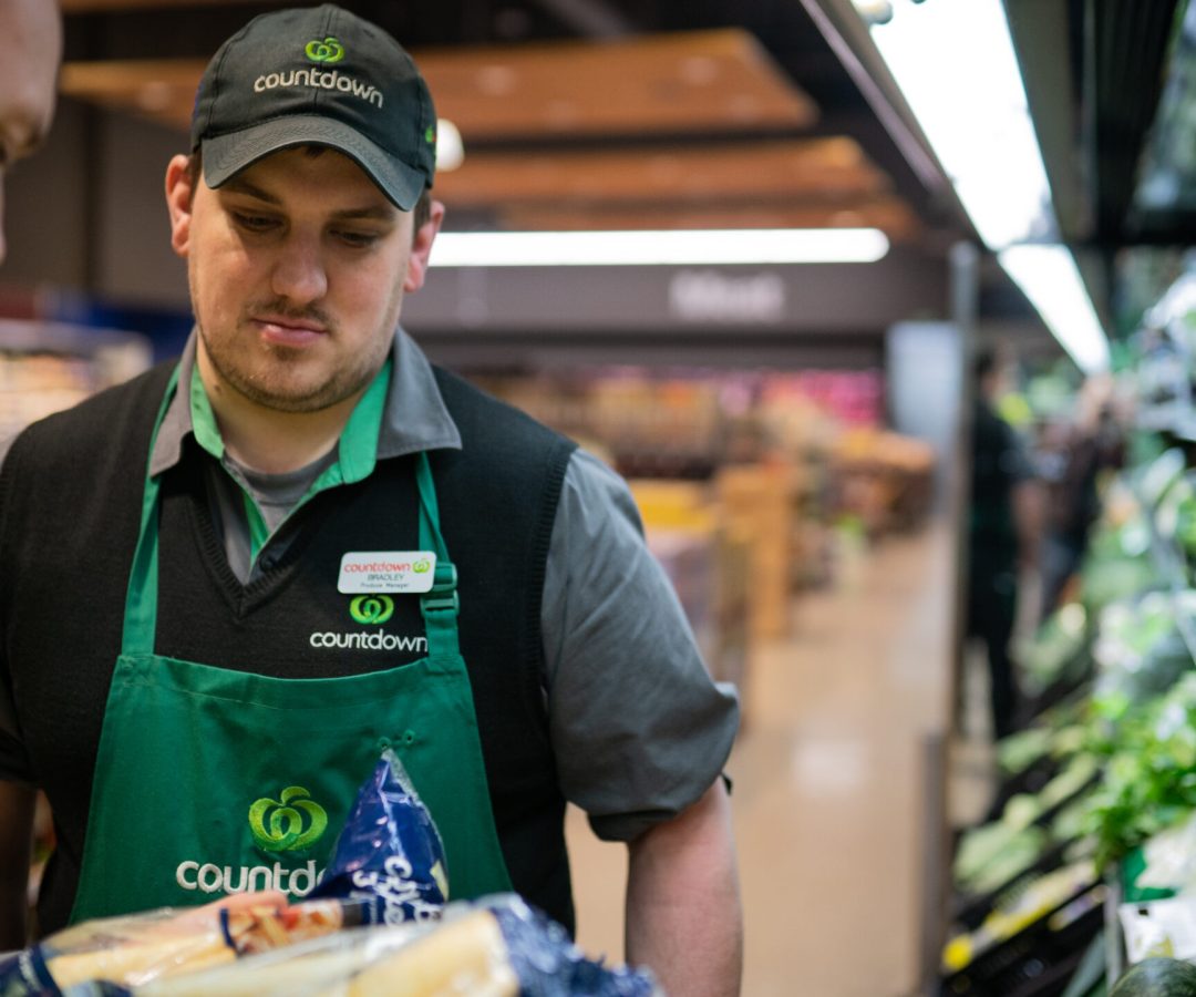 Countdown retail produce manager reviewing fresh vegetables, showing supermarket partnership with So Sweet