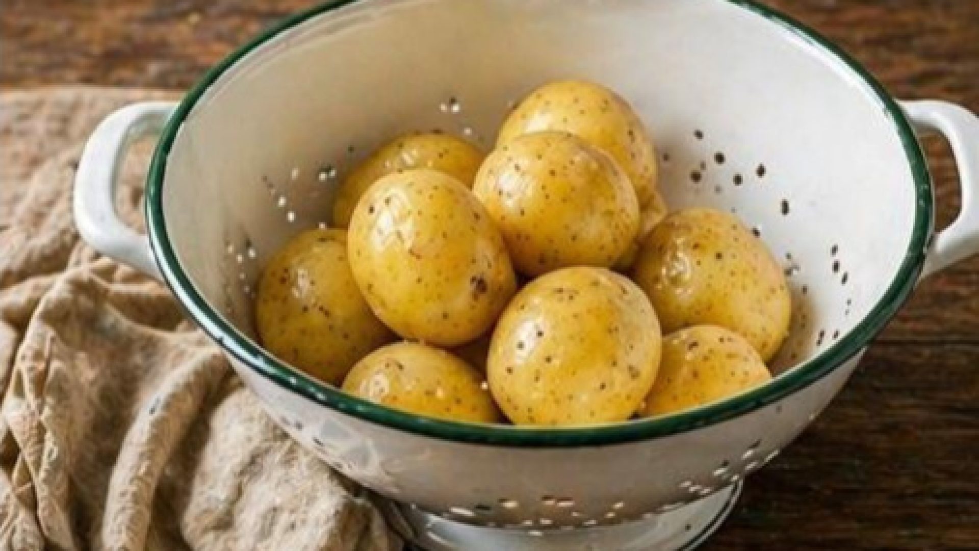 draining potatoes in colander after boiling